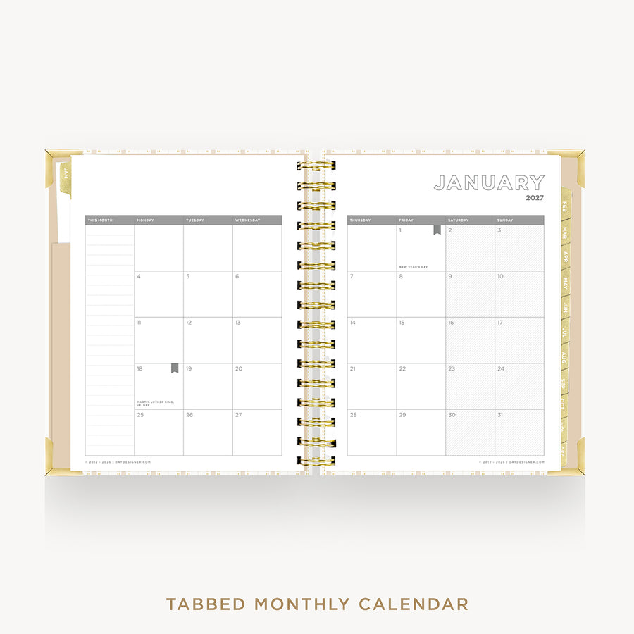 An open monthly calendar planner with gold spiral binding, showing January 2027 on the right page and tabbed monthly pages on the left. The cover is a warm beige with gold trim, set against a light gray background with the text 'TABBED MONTHLY CALENDAR' below.