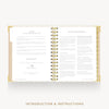 An open spiral-bound booklet with printed text pages, shown on a light gray background with the words 'INTRODUCTION & INSTRUCTIONS' below.