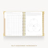 An open spiral-bound workbook showing self-assessment worksheet pages, including a table on the left and a Venn diagram on the right, with gold binding and a clean white background.