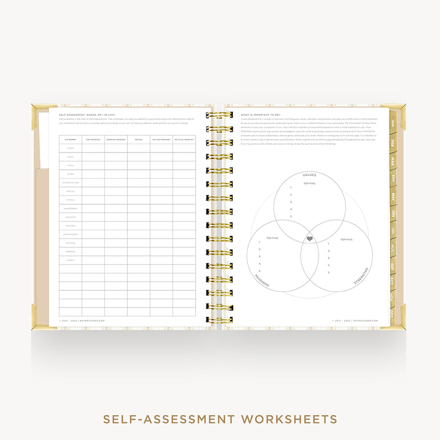 An open spiral-bound workbook showing self-assessment worksheet pages, including a table on the left and a Venn diagram on the right, with gold binding and a clean white background.