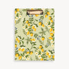 Clipboard with lemon and floral pattern on a light green background