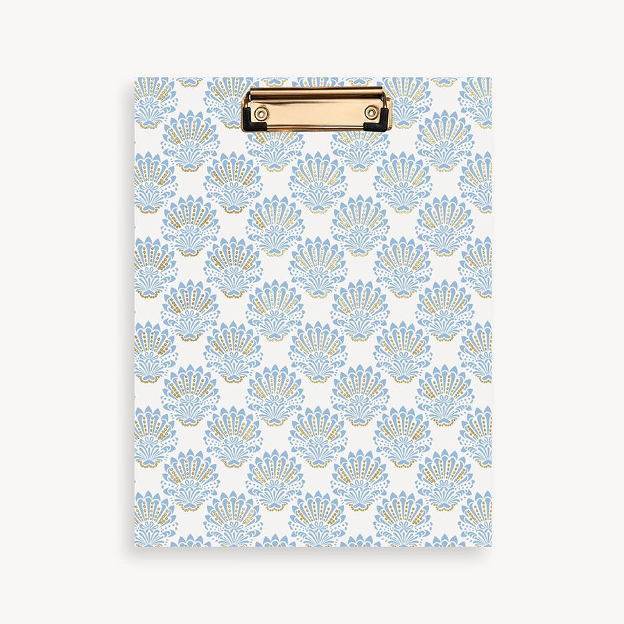 Clipboard with blue shell pattern on a white background