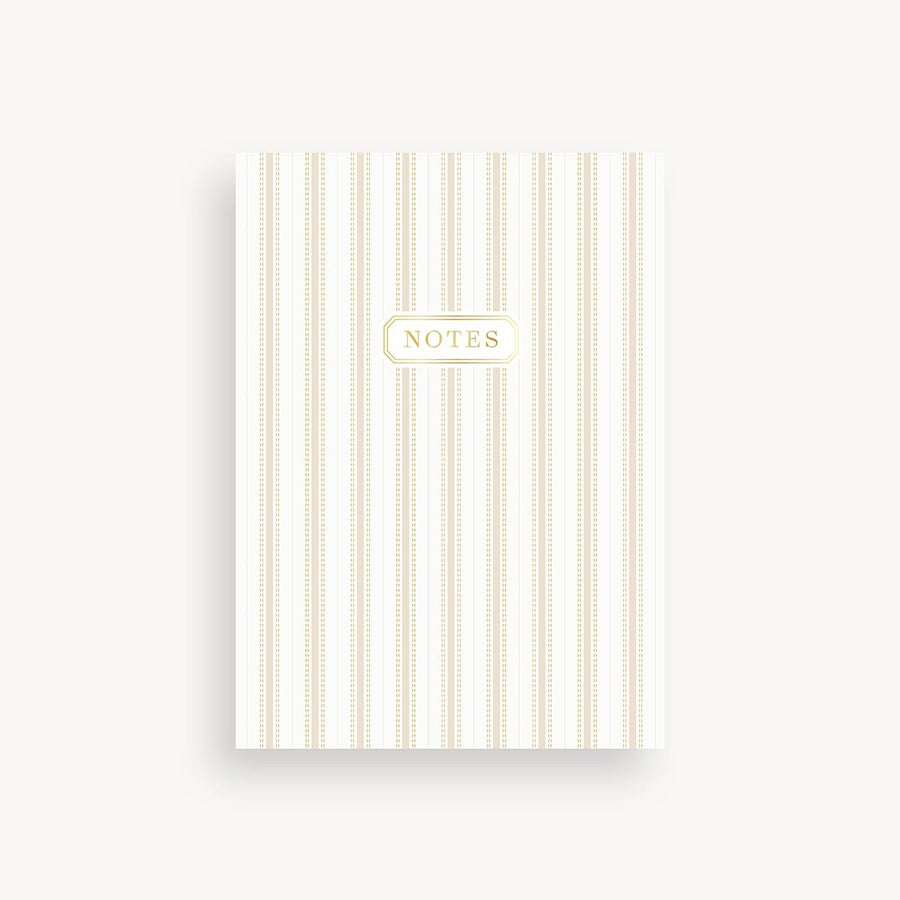 Notebook with gold stripes and 'Notes' label on a white background