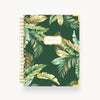 green and gold tropical leaves notebook on dark green background, gold binding and notes title