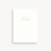 White notebook with gold polka dots and 'NOTES' label on a white background
