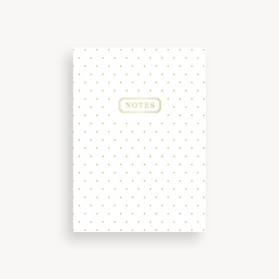 White notebook with gold polka dots and 'NOTES' label on a white background