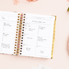 Day Designer 2024-25 mini weekly planner: Camellia opened with writing on it