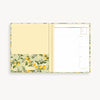 Notebook with floral lemon design on a white background