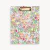 Colorful clipboard with a floral and building pattern on a white background