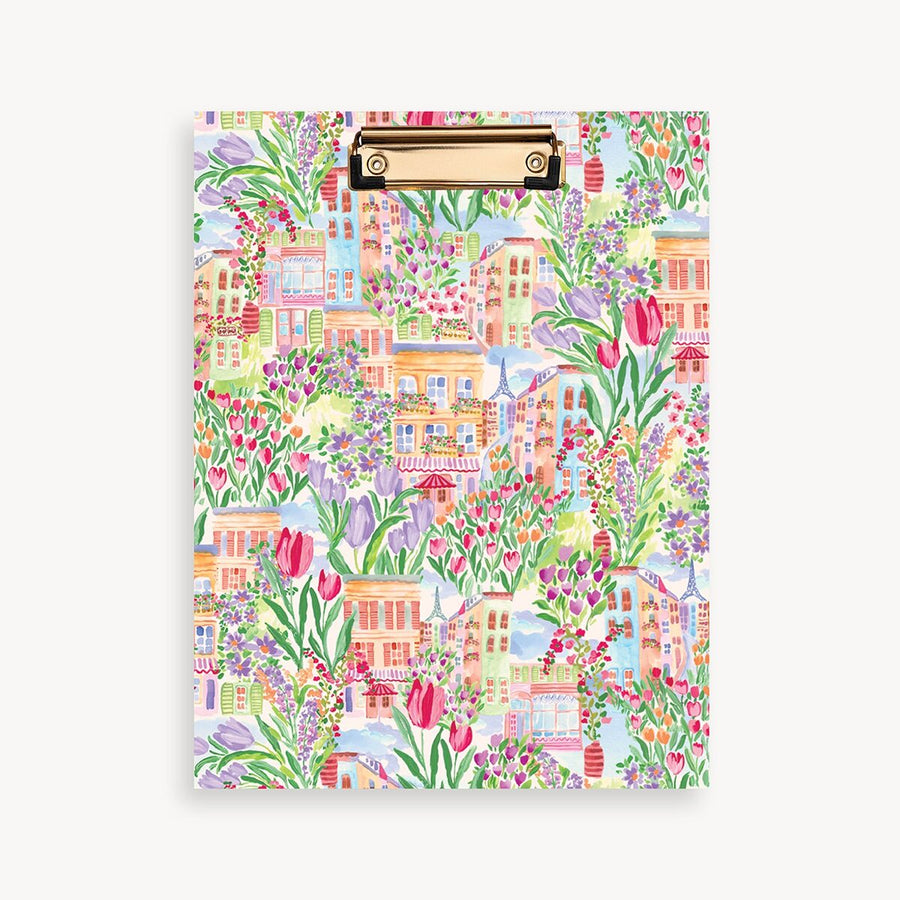 Colorful clipboard with a floral and building pattern on a white background