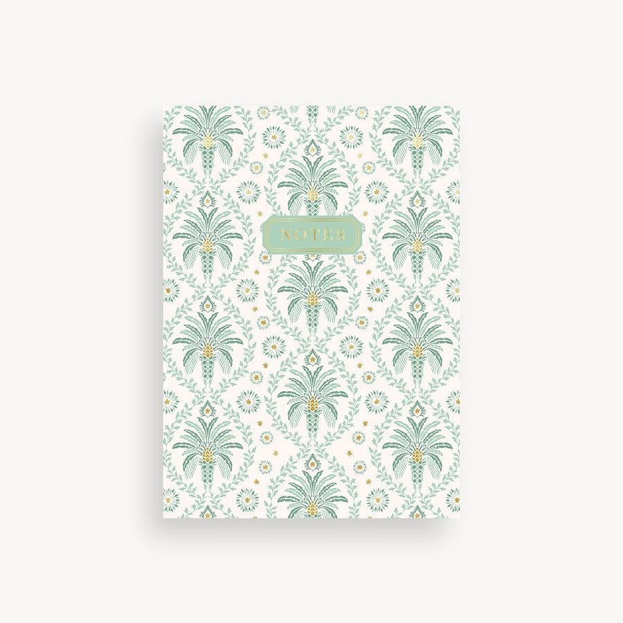 Notebook with palm tree pattern on a white background
