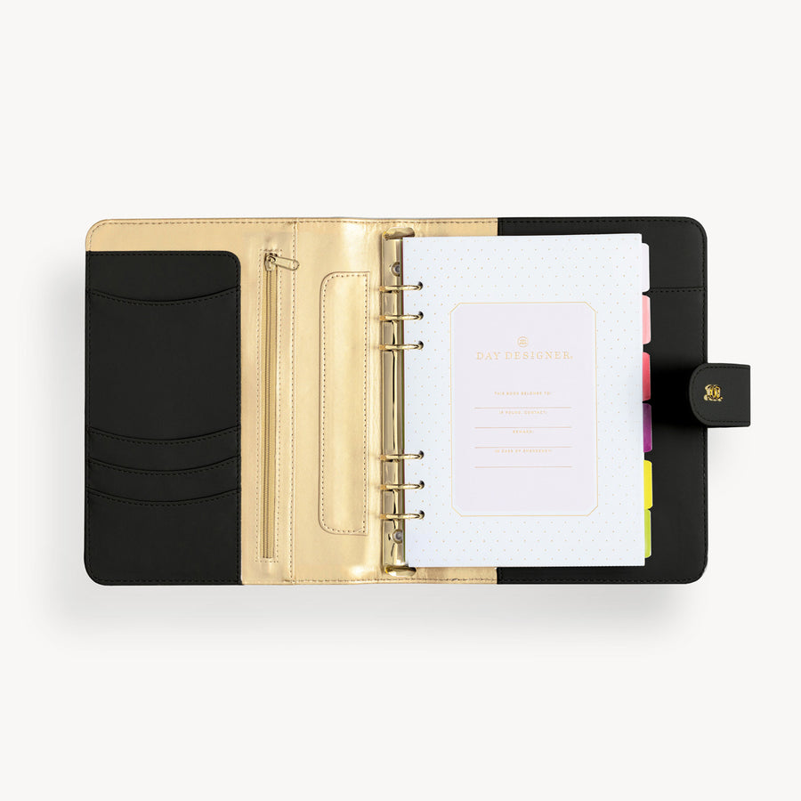 Open black A5 binder to show black and gold lining and binding, colorful pages