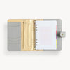 open gray A5 binder with refill pages, snap closure and gold day designer logo