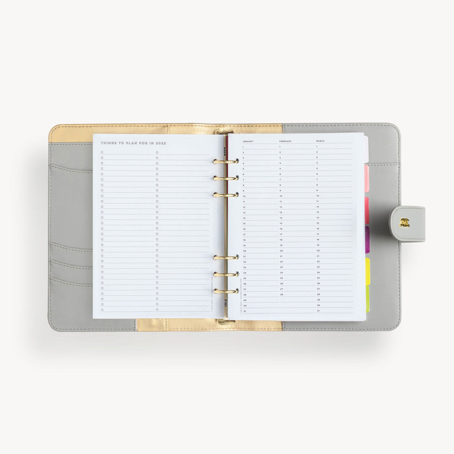 open gray A5 binder with things to plan for in 2025 pages, snap closure and gold day designer logo