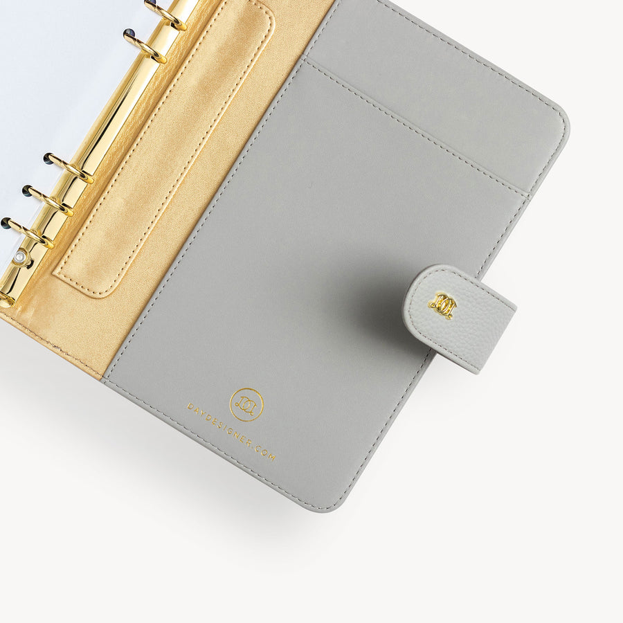 open gray A5 binder with snap closure and gold day designer logo