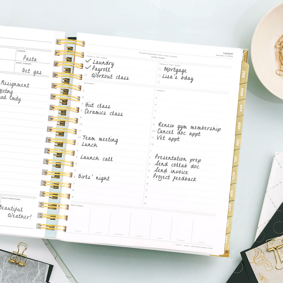 Day Designer 2024 daily planner: Black Stripe opened with writing on it