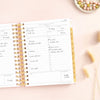 Day Designer 2026 mini daily planner: peony bookcloth opened with writing on it