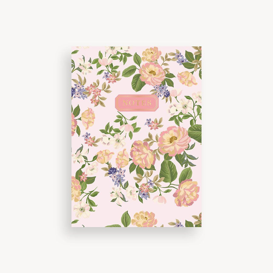 Floral notebook with a pink background on a white background