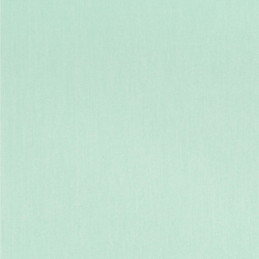 A close-up image of a sage green linen-look fabric cover of a daily planner.