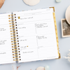 Day Designer 2025 weekly planner: Azure opened with writing on it