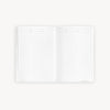 Open lined notes book on a white background