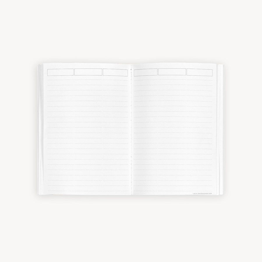 Open lined notes book on a white background