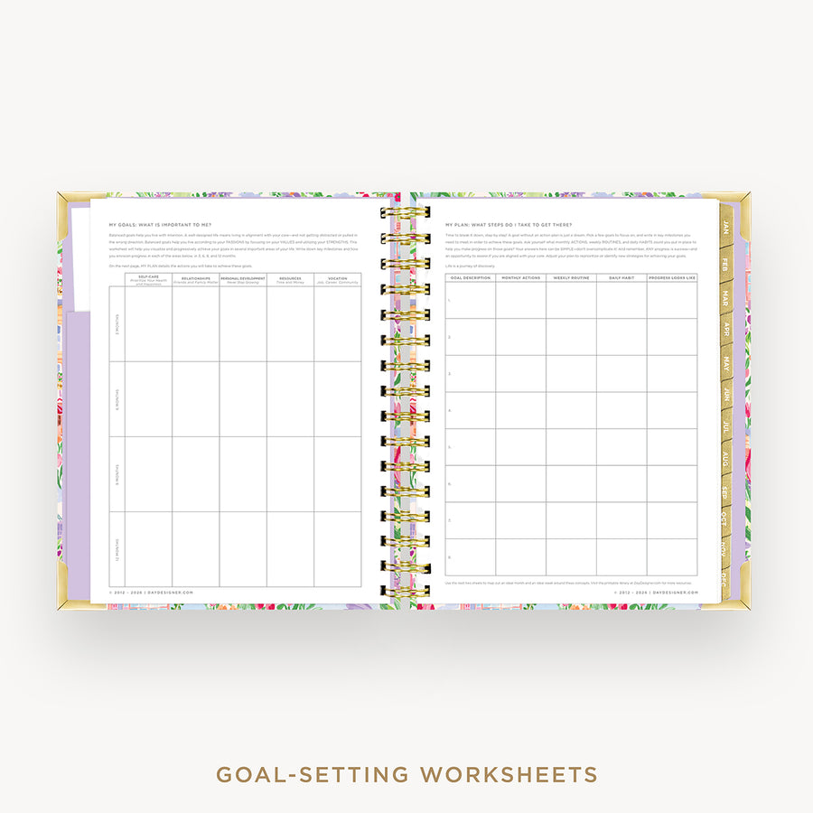 An open spiral-bound planner or agenda showing two printed goal-setting worksheet pages, with a floral-patterned cover and gold-toned rings, on a light gray background. Text below reads 'GOAL-SETTING WORKSHEETS'.