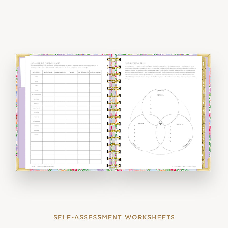 An open spiral-bound planner or notebook showing self-assessment worksheet pages, with a pastel floral patterned cover and gold-toned spiral binding on a light gray background.