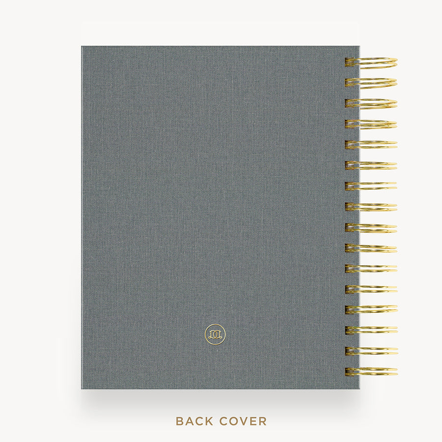 A gray textured notebook with gold spiral binding on the right side, shown against a white background with the text 'BACK COVER' below.