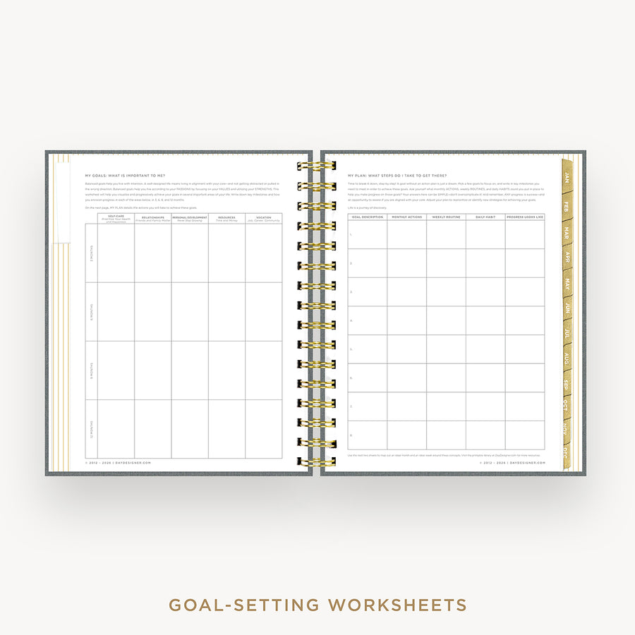 An open spiral-bound planner or workbook showing two printed goal-setting worksheet pages with gold accents and a gold ring binder, centered on a light gray background with the text 'GOAL-SETTING WORKSHEETS' below.