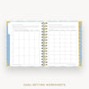 An open spiral-bound planner or notebook showing two printed goal-setting worksheet pages with tables and text, set against a light gray background with the words 'GOAL-SETTING WORKSHEETS' below.