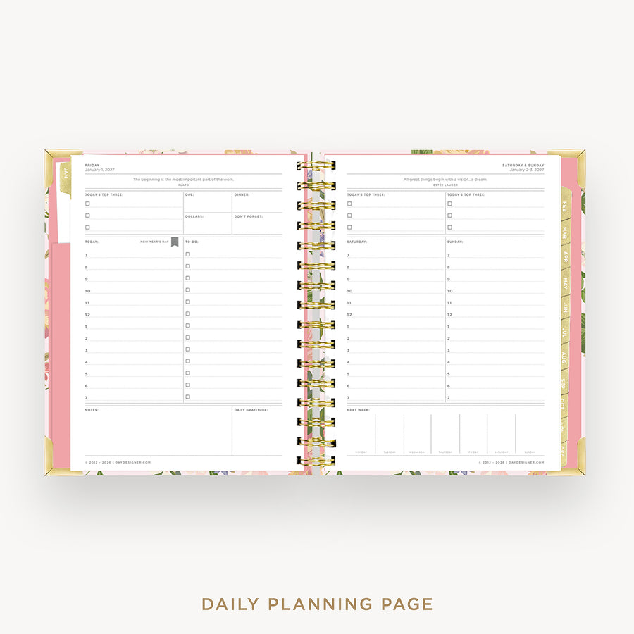 An open spiral-bound daily planner showing two lined daily planning pages with floral-patterned covers and gold-tone spiral binding, photographed on a light gray background with the text 'DAILY PLANNING PAGE' below.