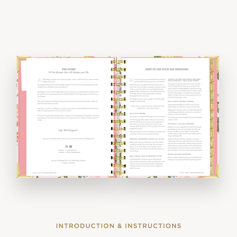 An open spiral-bound journal or planner showing printed introduction and instruction pages, with a pink and gold floral-patterned cover and the text 'INTRODUCTION & INSTRUCTIONS' below.