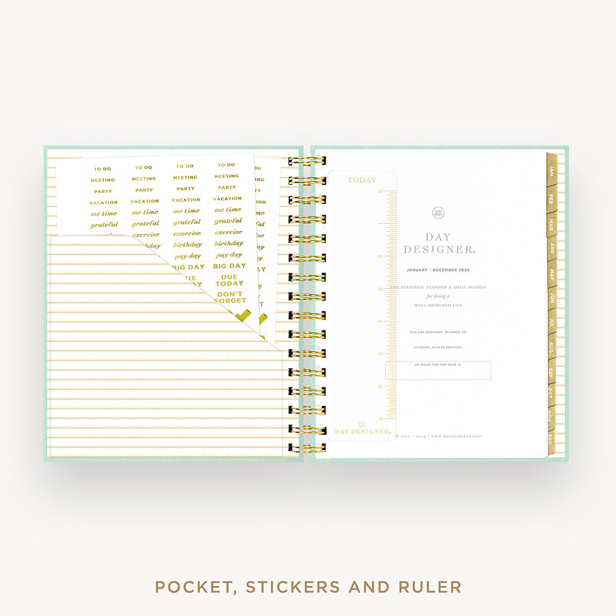An open spiral-bound planner or pocket organizer shown from the inside, with lined pages on the left, a daily planner page on the right, gold text accents, and a mint border. Below the product, the text reads 'POCKET, STICKERS AND RULER'.