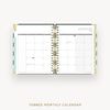 Tabbed monthly calendar open to January on a white background