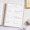 Day Designer 2024 weekly planner: Blurred Spring opened with writing on it