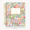 Colorful planner cover with floral and building design, featuring 'Day Designer' branding.