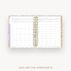 Goal-setting worksheets in a planner with colorful border on a white background