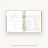 Open book with colorful floral design on a white background