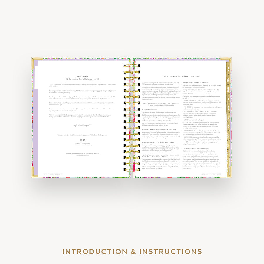 Open book with colorful floral design on a white background