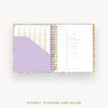 Open planner showing a pocket, stickers, and ruler on a white background