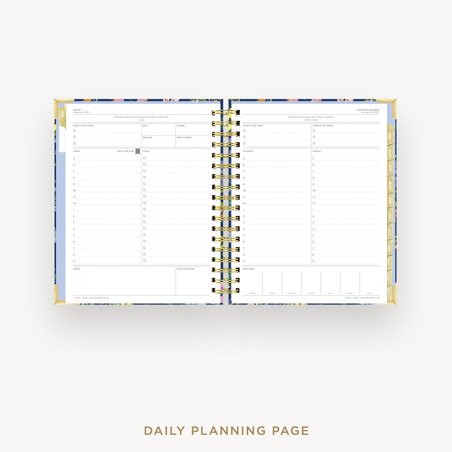 Open daily planner with spiral binding on a white background