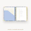 Open planner showing a pocket, stickers, and ruler section on a white background