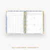 Open wire-bound book displaying self-assessment worksheets with a Venn diagram on a white background.