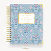 Floral patterned planner with 'Day Designer' branding on a white background