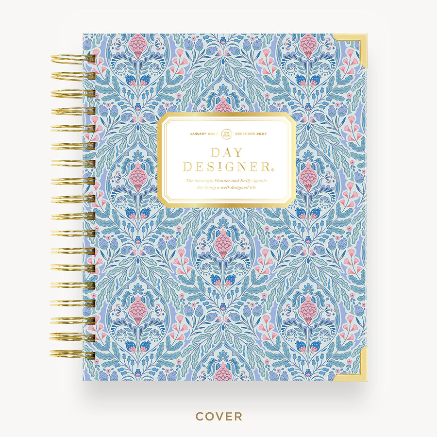 Floral patterned planner with 'Day Designer' branding on a white background