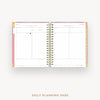 Daily planning page from a planner with a pink border on a white background