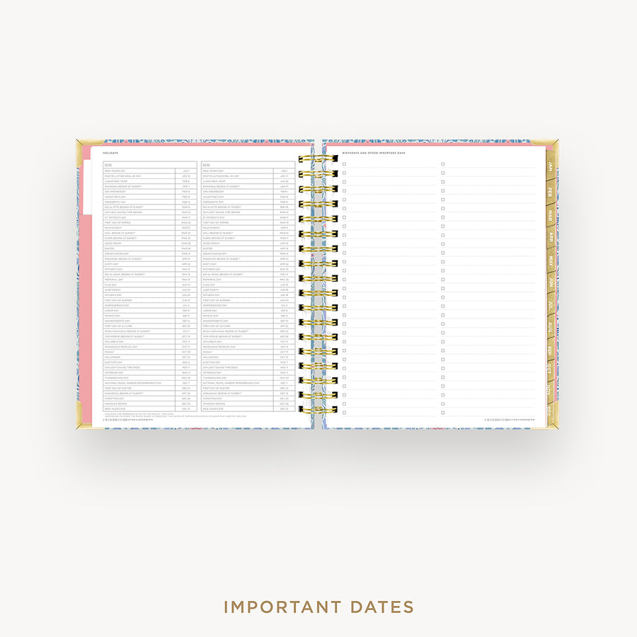 Wire-bound planner with a pink cover and white pages on a white background