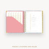 Open planner showing a pocket, stickers, and ruler on a white background