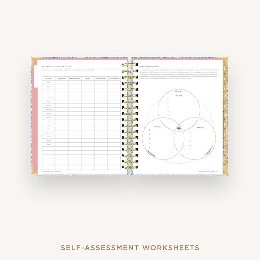 Open wire-bound book with self-assessment worksheets on a white background